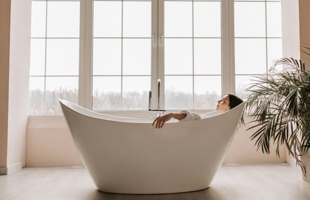 Modern freestanding bathtub in a renovated bathroom designed for relaxation and comfort.