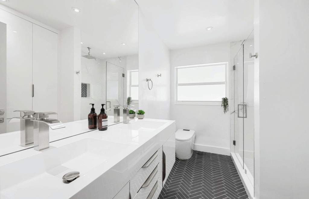 Modern bathroom remodel with new tile, vanity, and walk-in shower installation