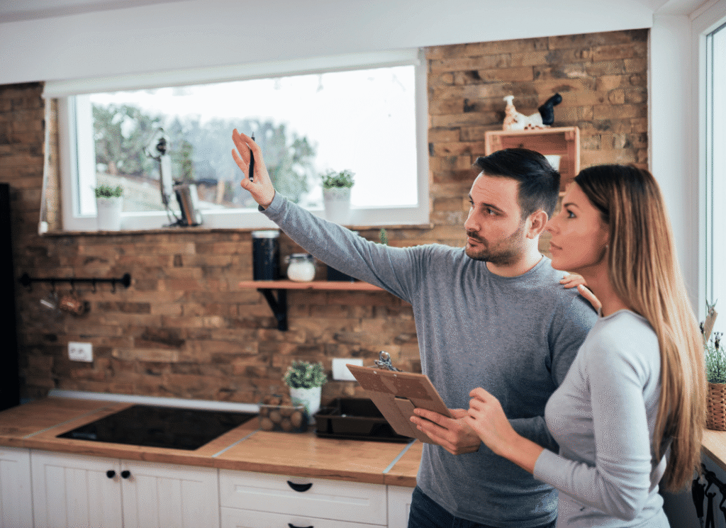 Homeowner reviewing kitchen renovation budget options and planning full remodel versus partial upgrade