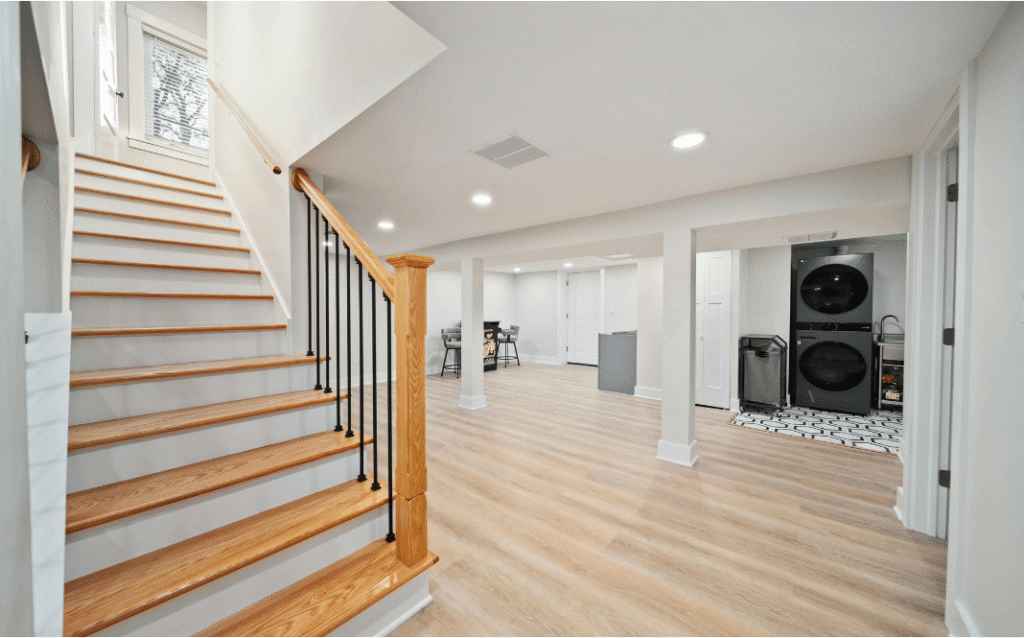 Modern finished basement renovation featuring a comfortable living area, recessed lighting, custom storage, and contemporary design elements that increase home value.