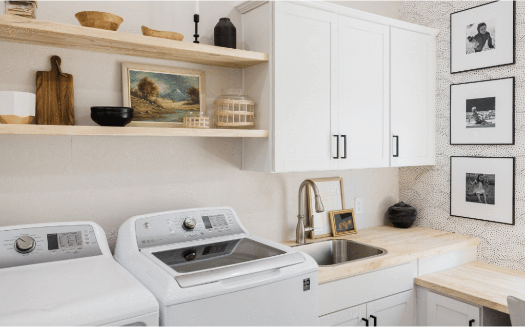 A beautifully renovated laundry room with custom storage, durable finishes, and modern appliances designed to improve organization and functionality.