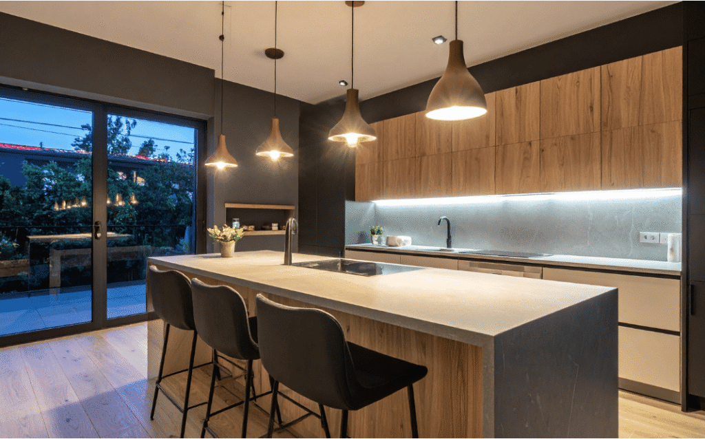 Contemporary kitchen with statement pendant lights above a kitchen island