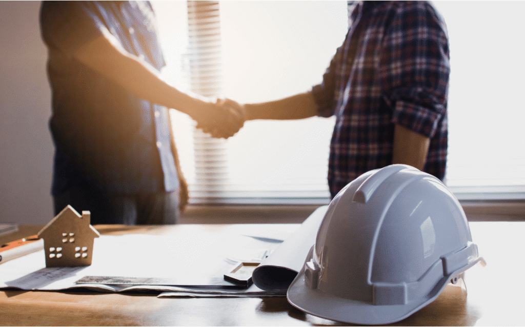 Renovation contractor explaining building permit requirements to homeowners in London Ontario